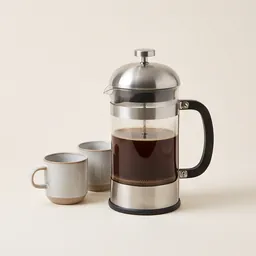 A glass cafetiere with two cups
