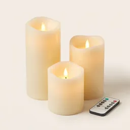 Three flameless LED candles glowing warm