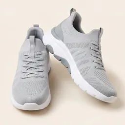 A pair of grey knit walking trainers