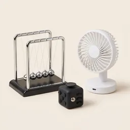 A Newton's cradle, fidget cube and mini desk fan