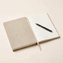 A linen reading journal and a pen
